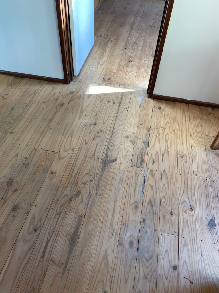 Pine timber floor before sanding and polishing in Belconnen Canberra